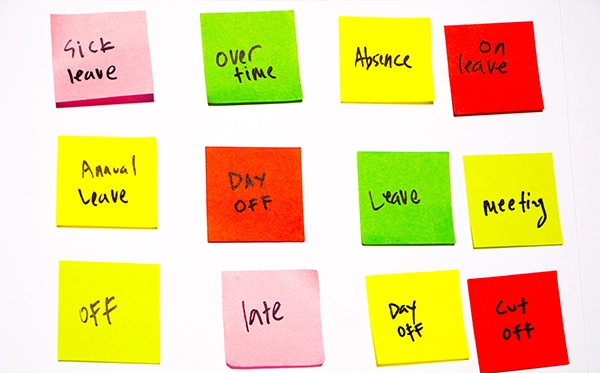 Admin Drag HR administrator managing employee sick leave records on spreadsheets